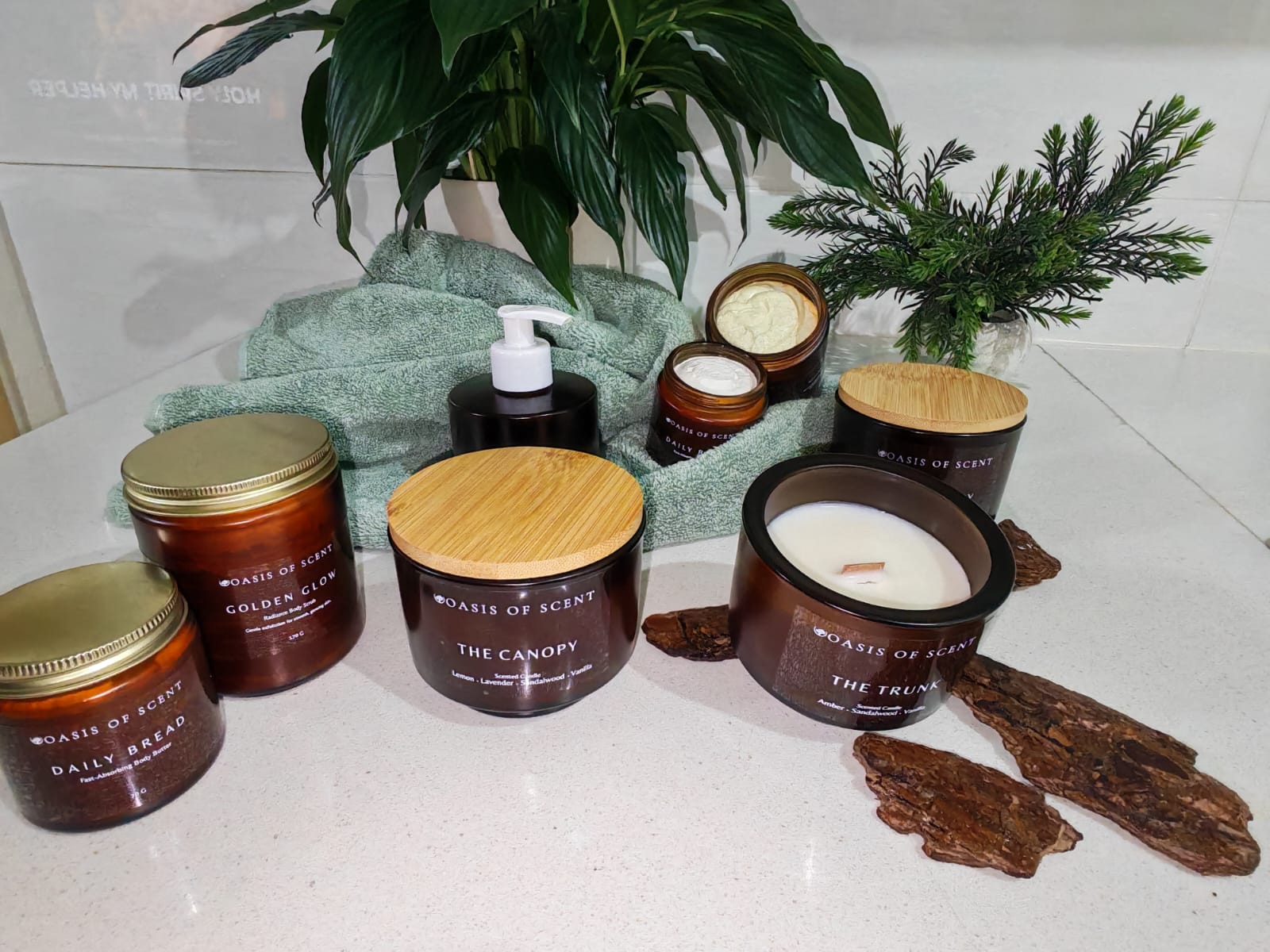 Oasis of Scent body butter, body scrub and scented candles displayed together